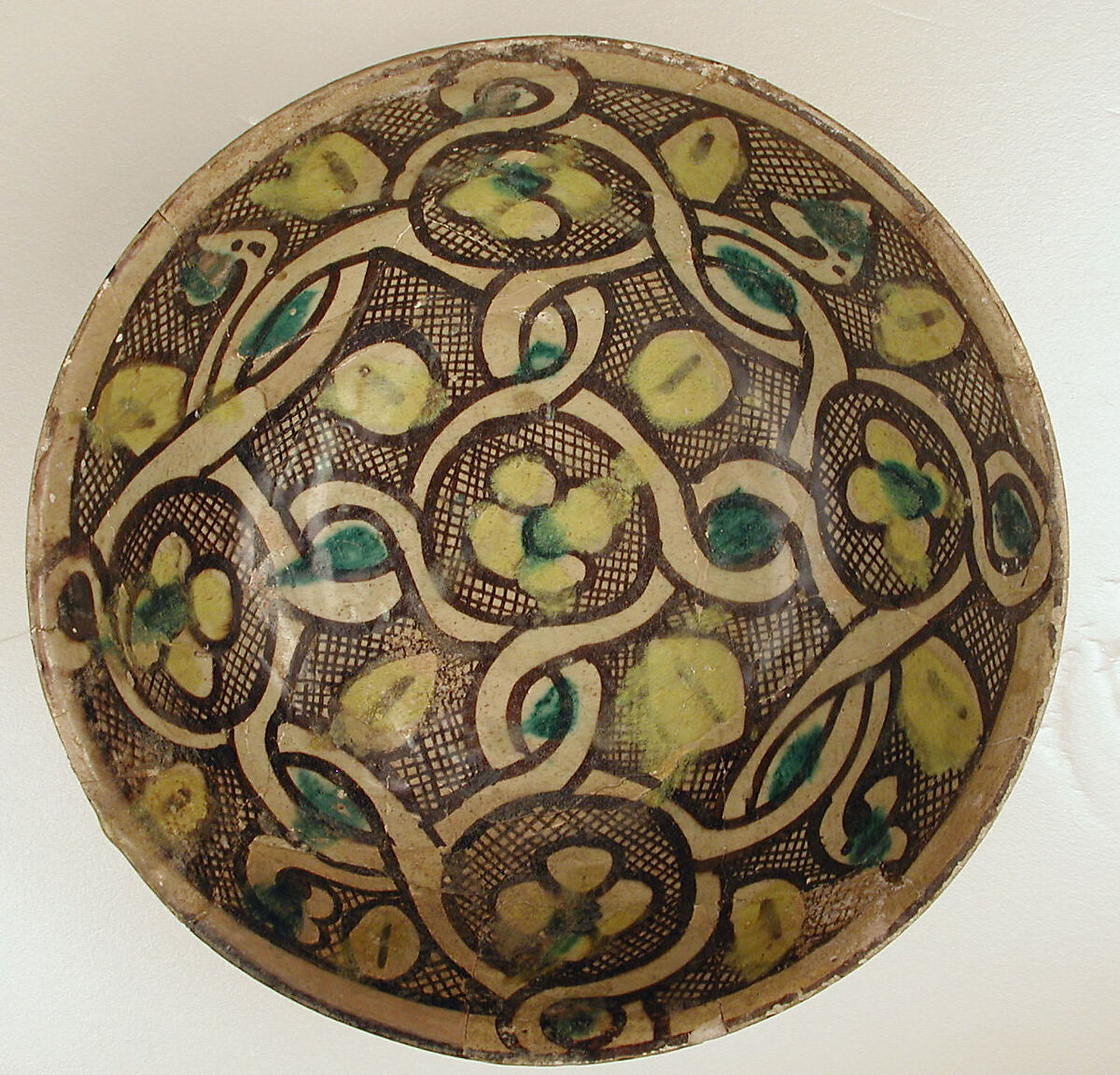 Bowl with Interlace Pattern and Yellow Flowers, Earthenware; polychrome decoration under transparent glaze (buff ware) 