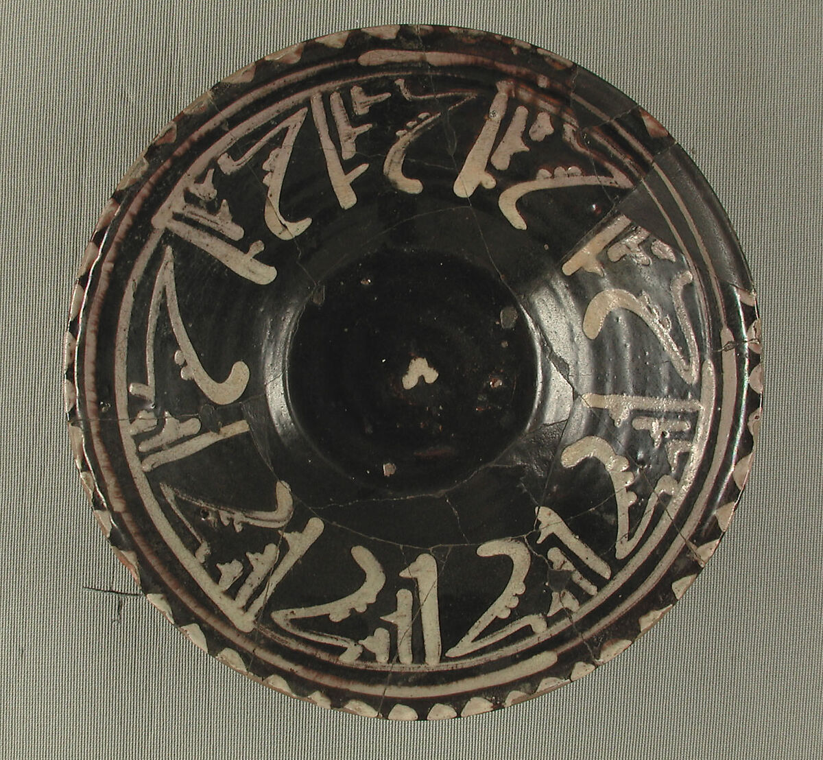 Bowls with Repeating Inscription, "Blessing", Earthenware; black slip with white slip decoration under transparent glaze