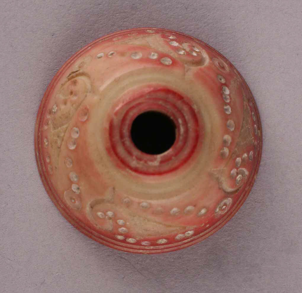 Spindle Whorl, Bone; tinted, incised, and inlaid with paint 