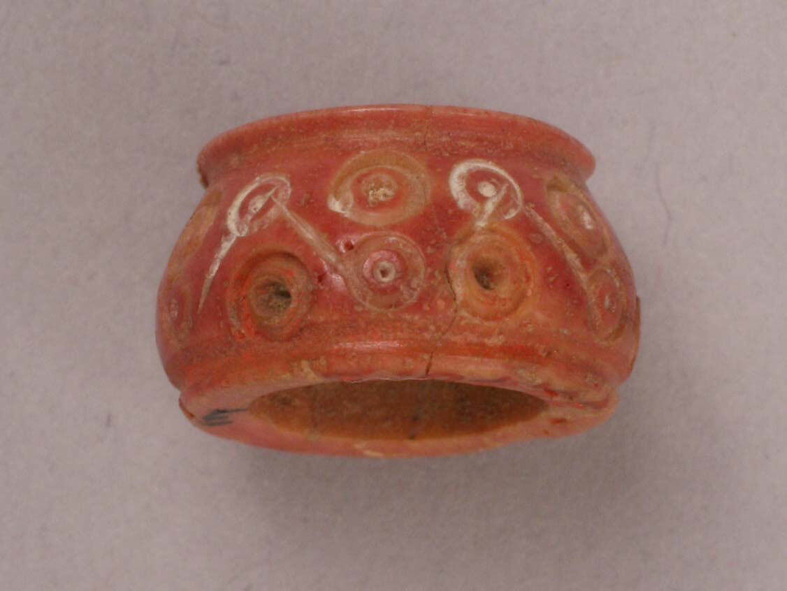 Button, Bone; tinted, incised, and inlaid with paint 