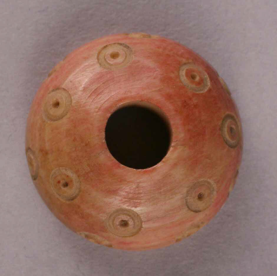 Spindle Whorl, Bone; tinted and incised 