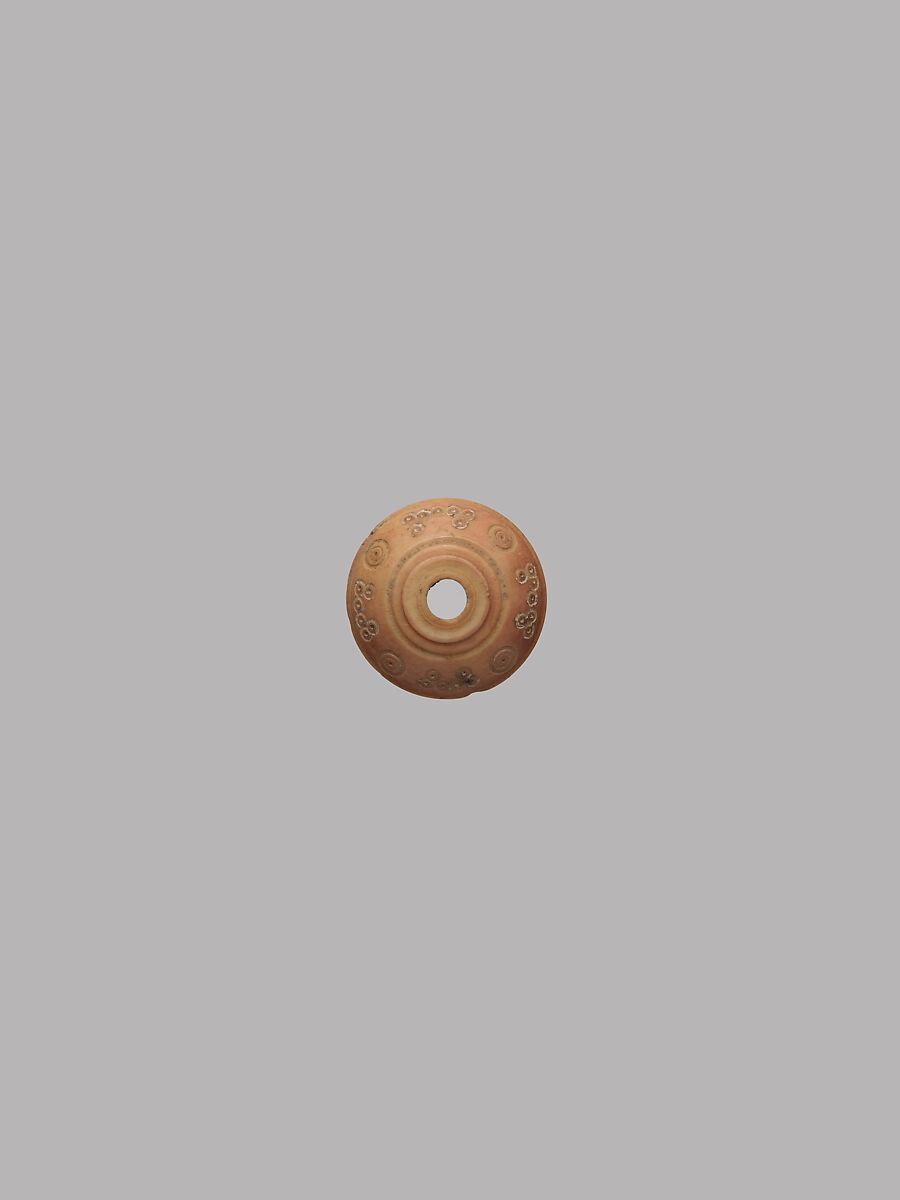 Button or Spindle Whorl, Bone; tinted, incised, and inlaid with paint 