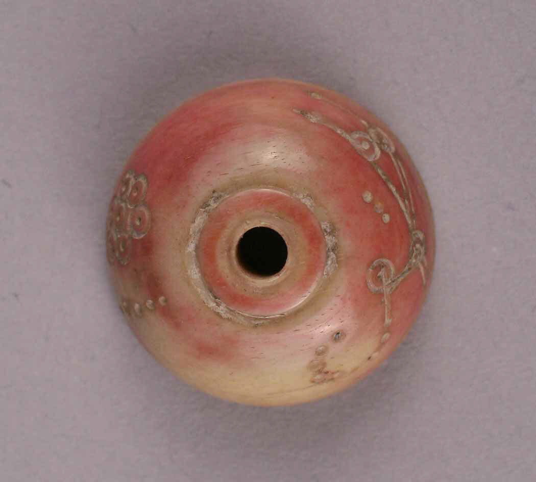 Spindle Whorl, Bone; tinted, incised, and inlaid with paint 