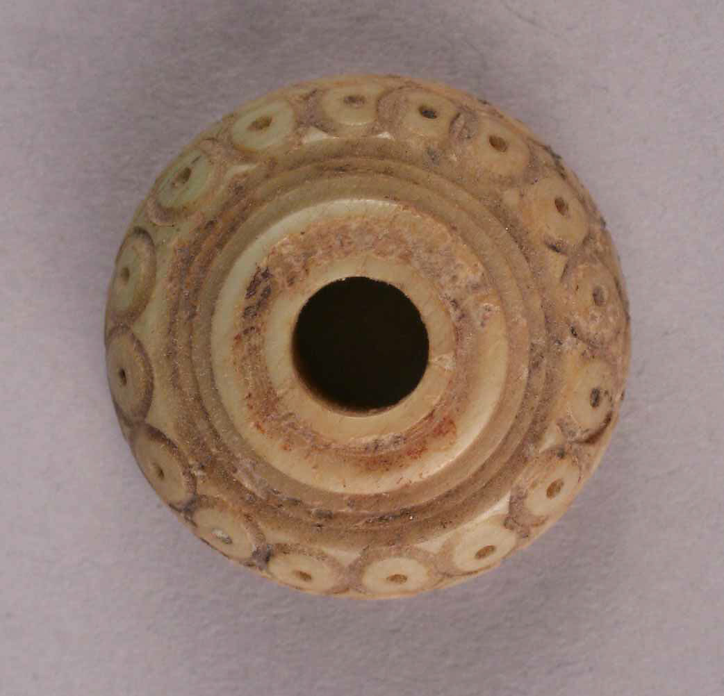 Button, Bone; tinted, incised, and inlaid with paint 