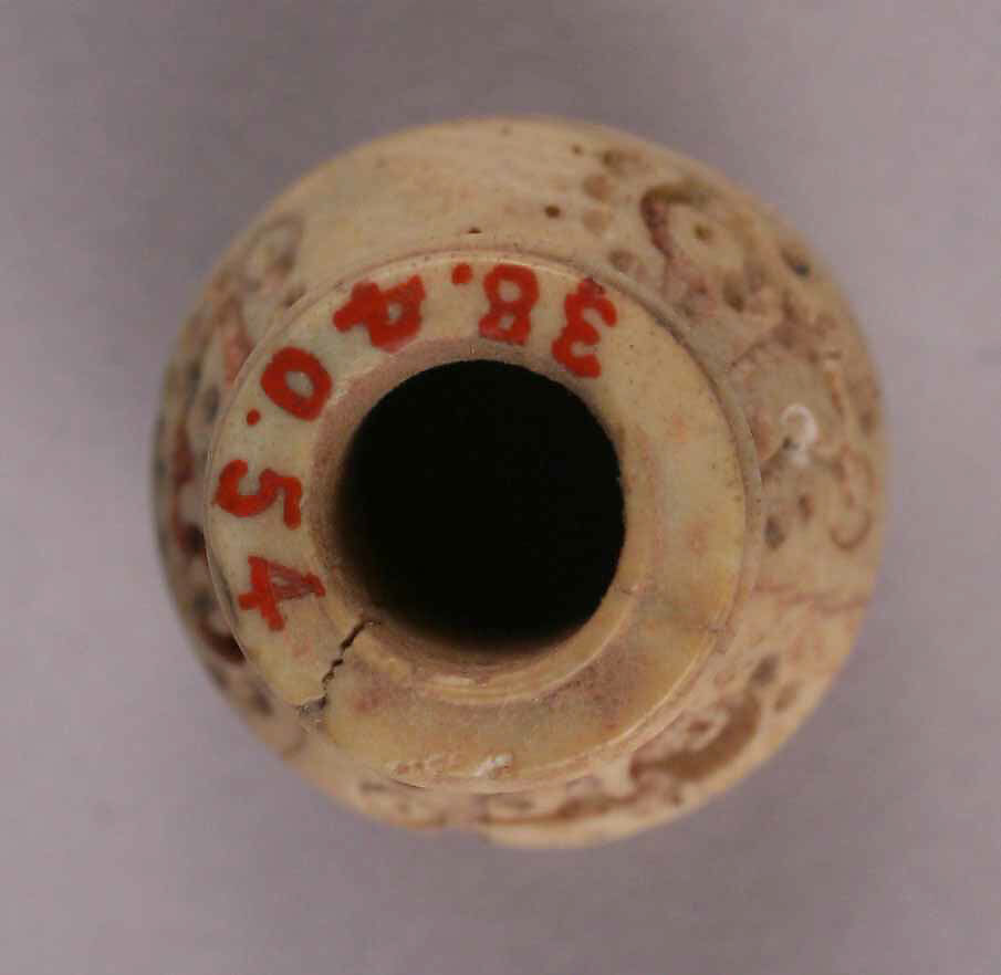 Bead, Bone; incised and inlaid with paint