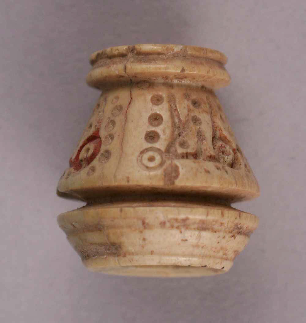Bead, Bone; incised and inlaid with paint 