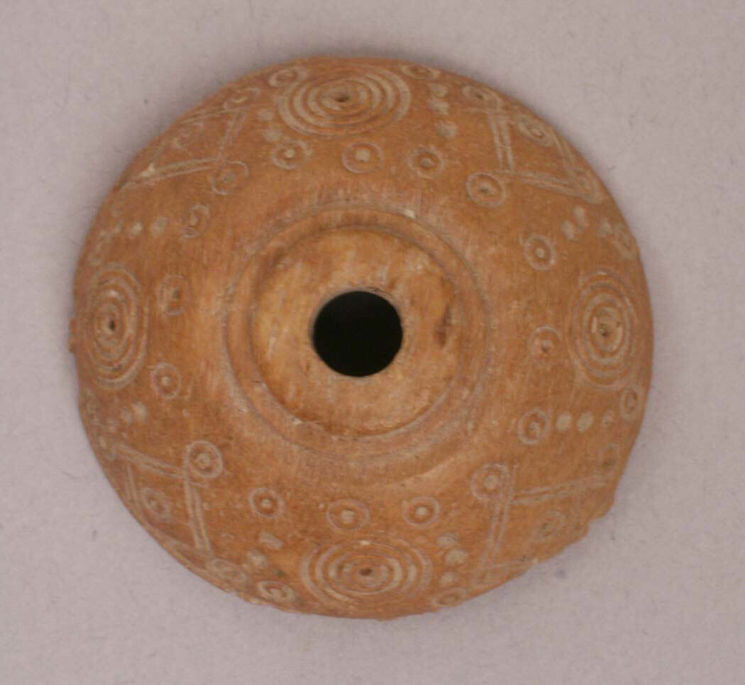 Button or Spindle Whorl, Bone; tinted, incised, and inlaid with paint 
