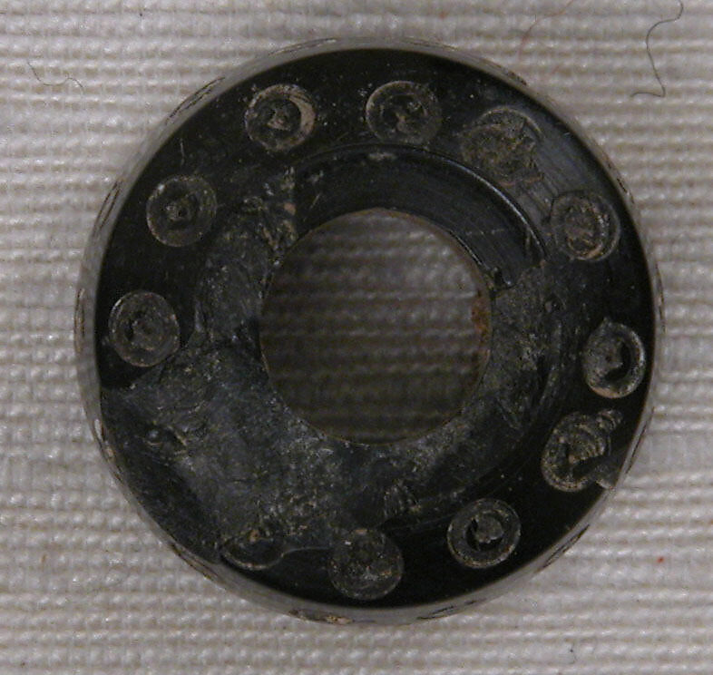 Button, Jet; carved