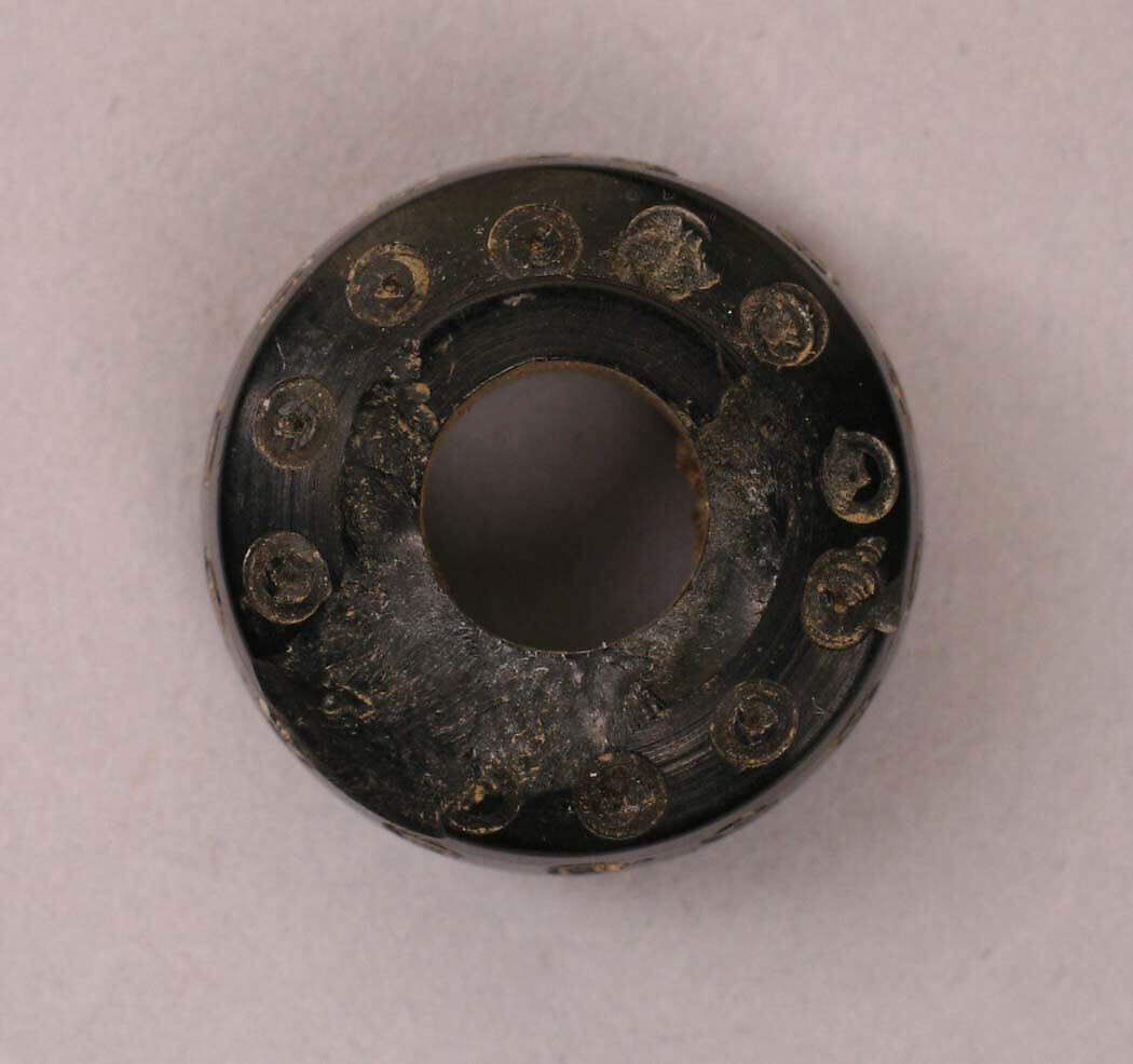 Button, Jet; carved 