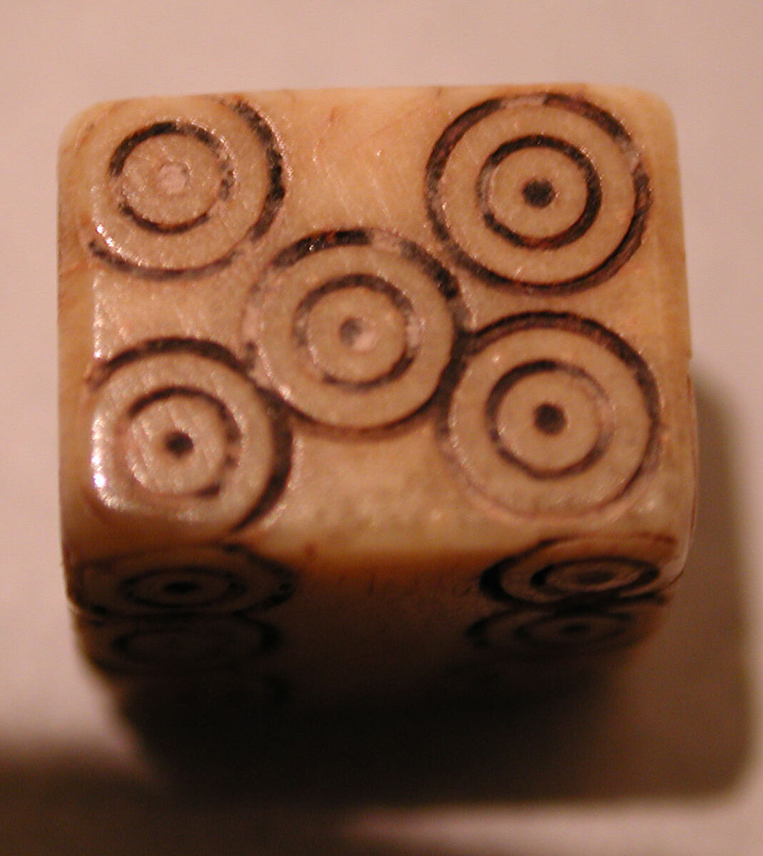 Dice, Ivory or bone; incised and inlaid with paint