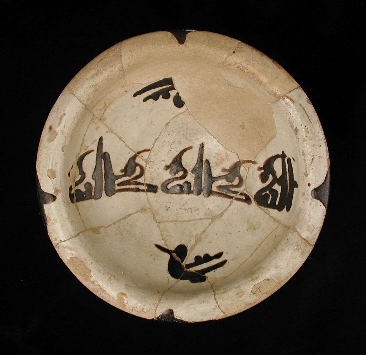 Three Bowls with Floriated Kufic Inscriptions, Earthenware; white slip with black slip decoration under transparent glaze 