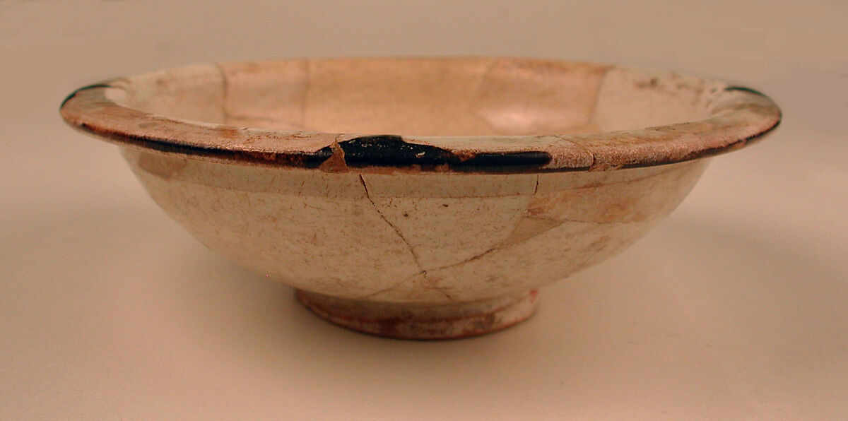 Three Bowls with Floriated Kufic Inscriptions, Earthenware; white slip with black slip decoration under transparent glaze