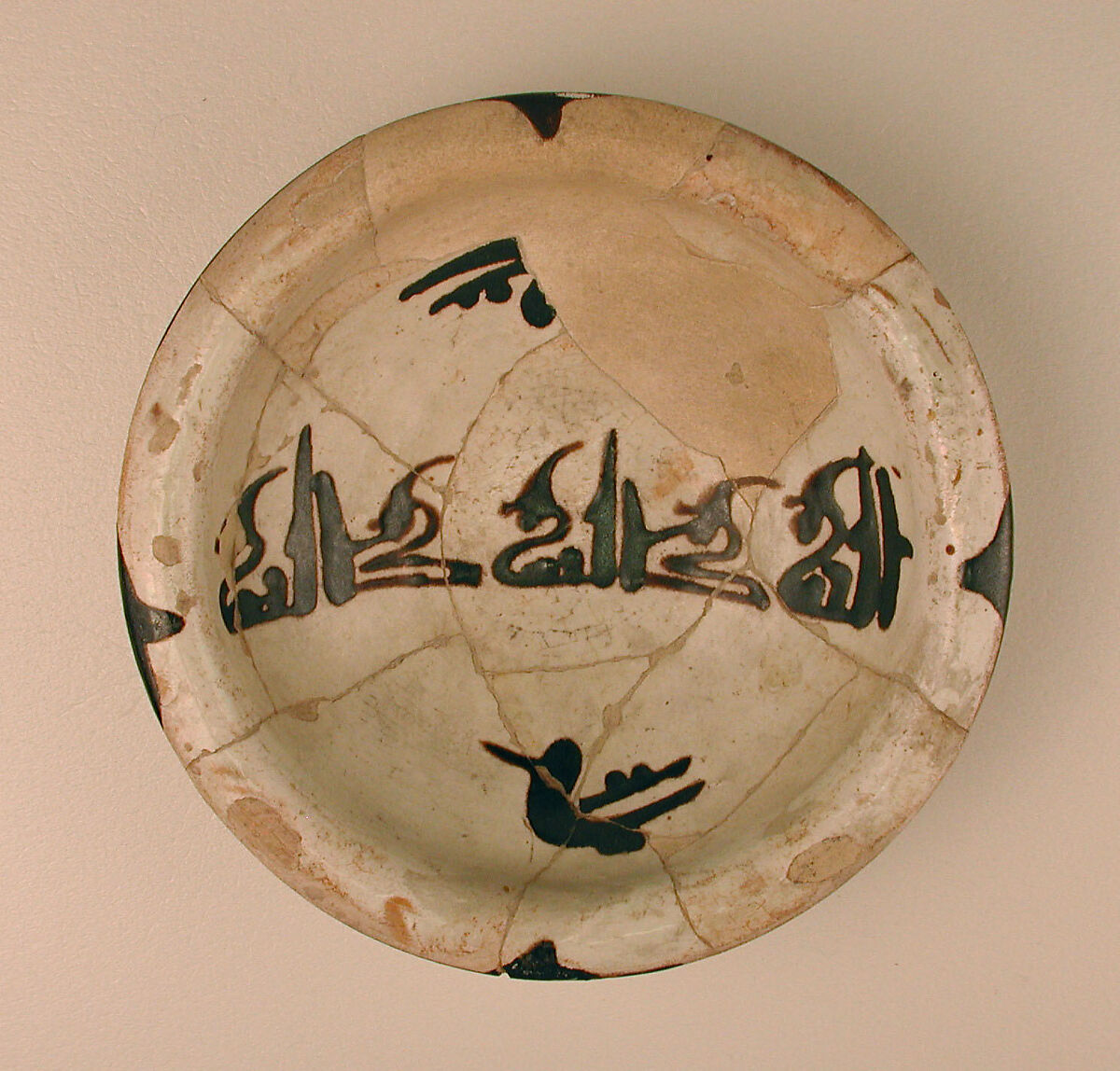 Three Bowls with Floriated Kufic Inscriptions, Earthenware; white slip with black slip decoration under transparent glaze