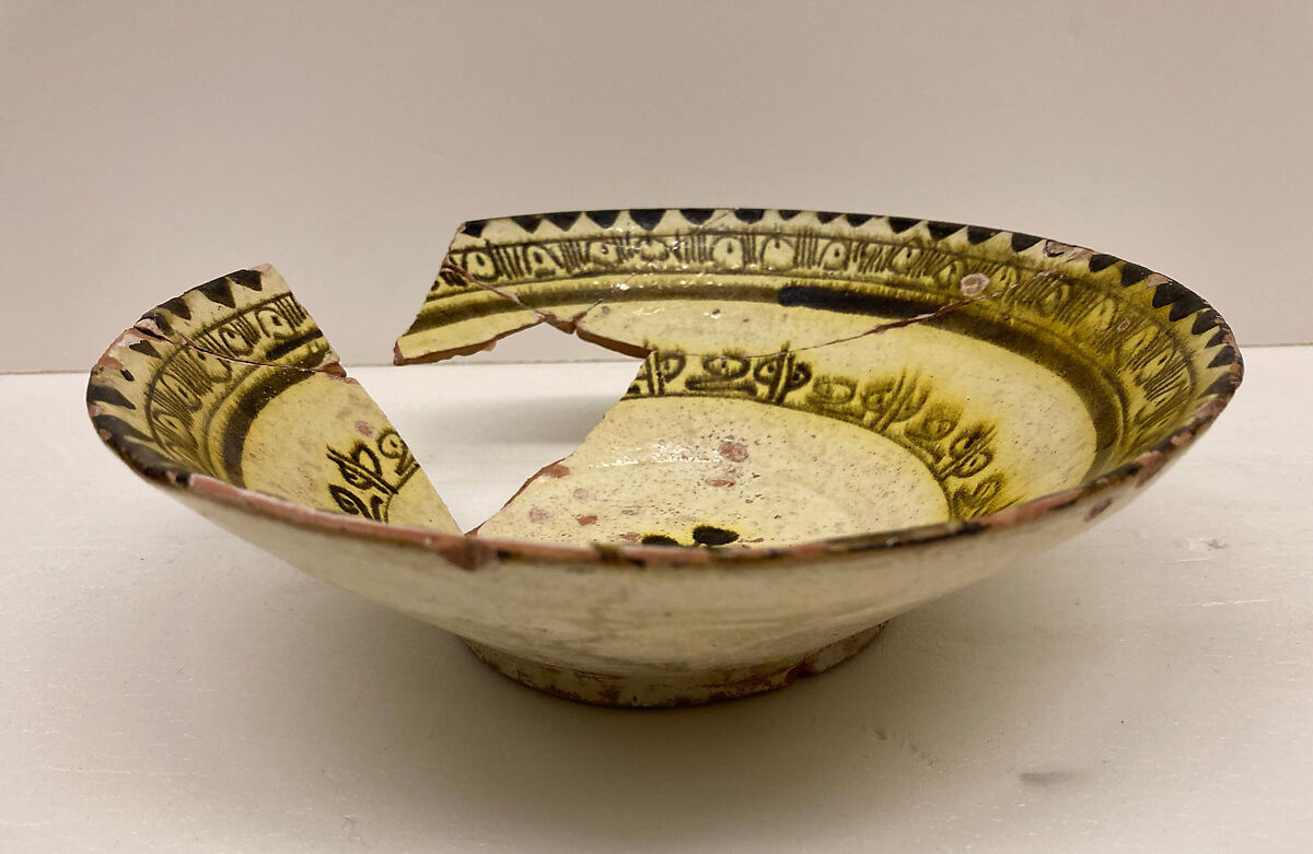 Bowl, Earthenware; white slip under clear yellow glaze 