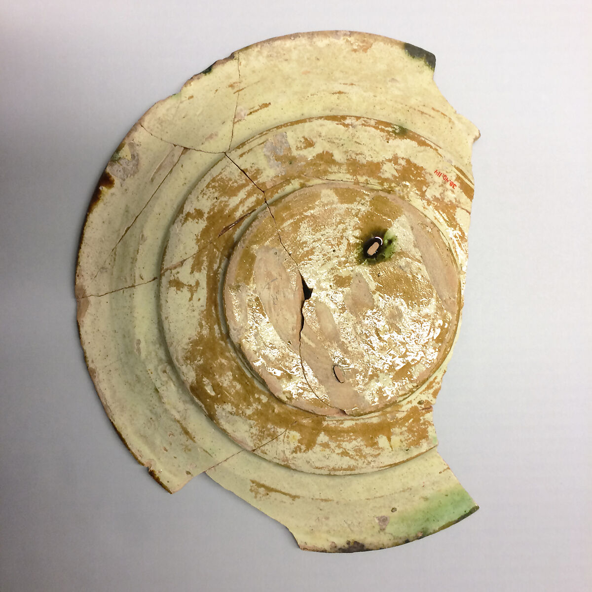 Plate, Earthenware; white slip, incised and splashed with polychrome glazes under transparent glaze (sgraffito ware)