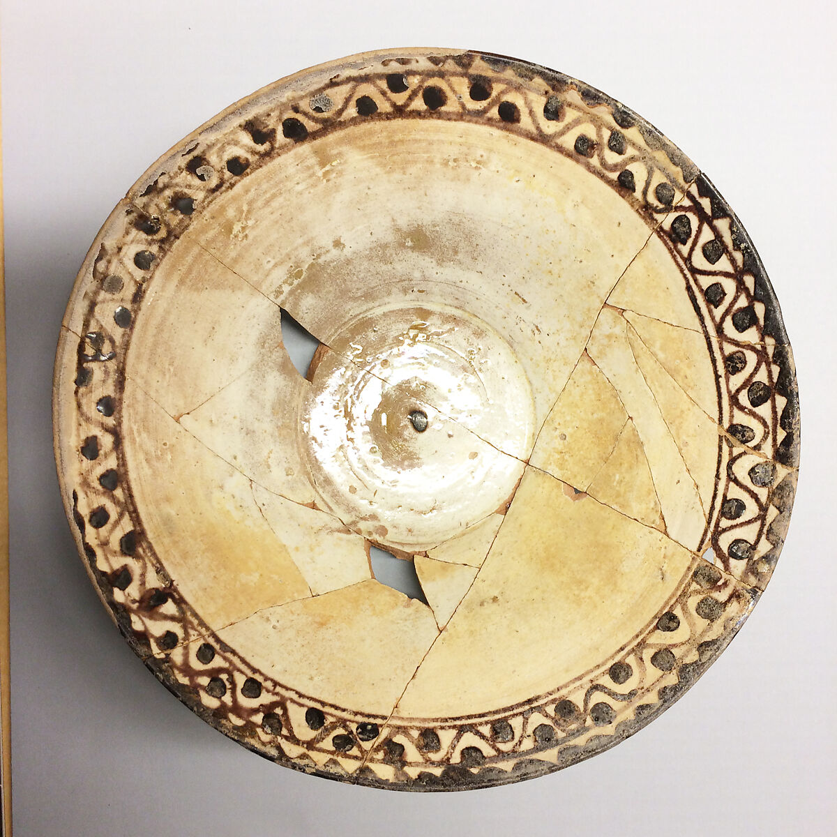 Bowl, Earthenware; white slip with polychrome slip decoration under transparent glaze 