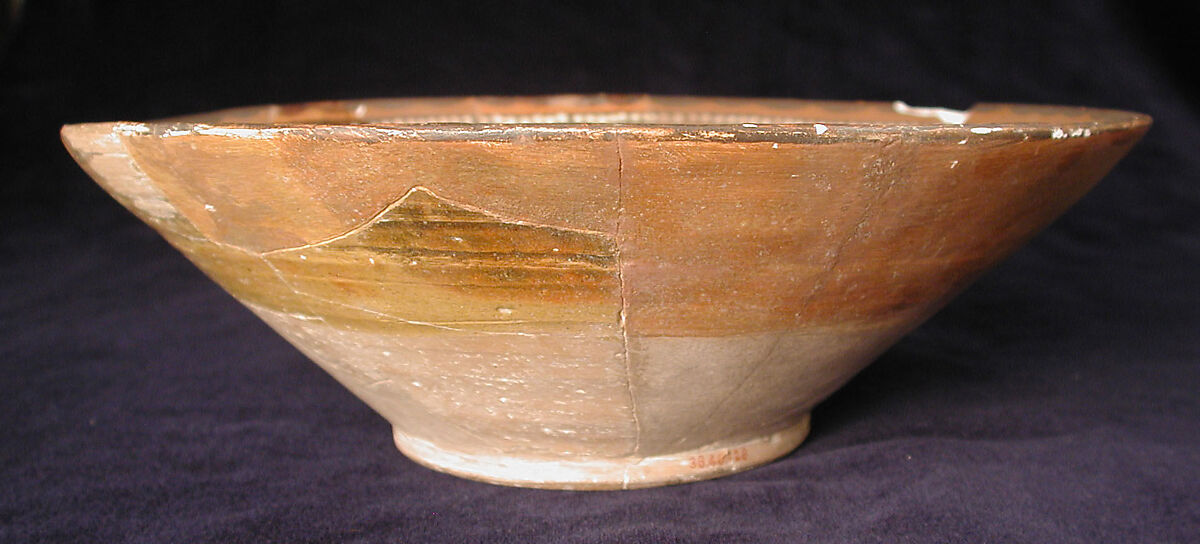 Bowl, Earthenware; red slip with polychrome slip decoration under transparent glaze