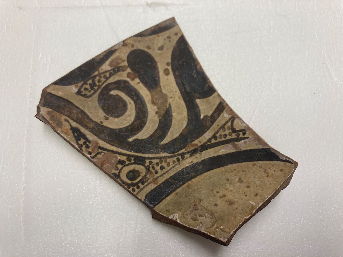 Fragment of a Bowl, Earthenware; slip covered with monochrome slip decoration under transparent glaze 