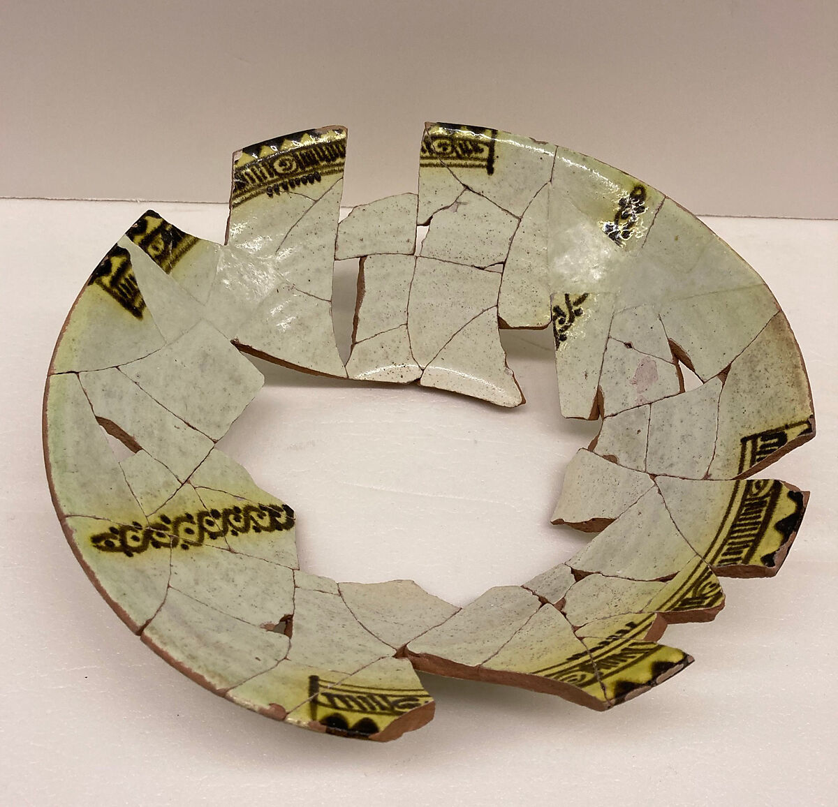 Bowl, Earthenware; slip covered with monochrome slip decoration under clear yellow glaze 