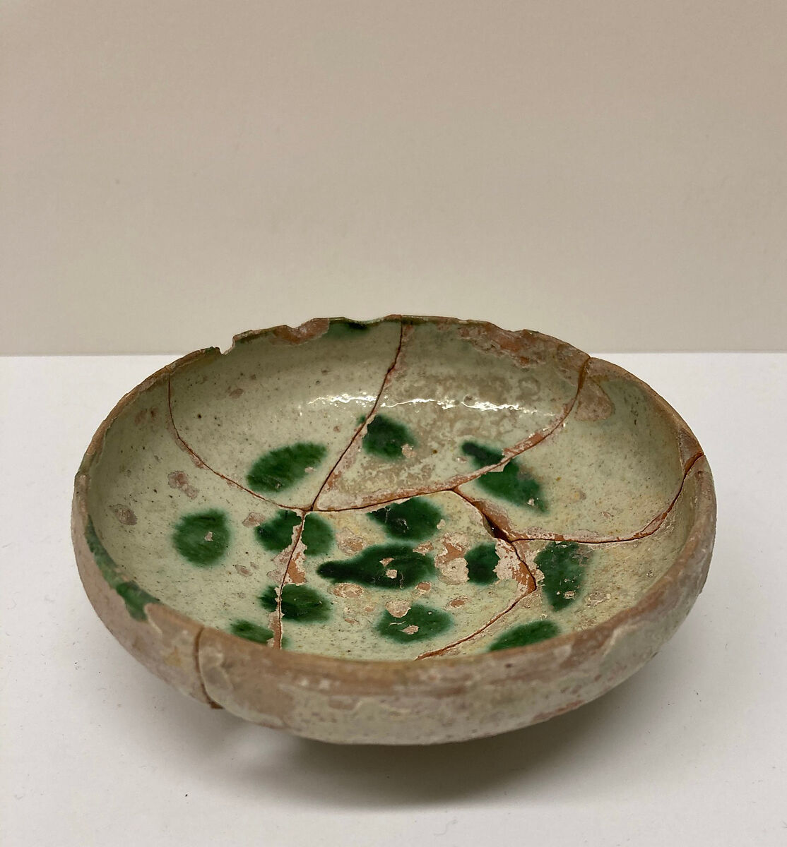 Bowl, Earthenware; white slip with polychrome slip decoration under transparent greenish glaze