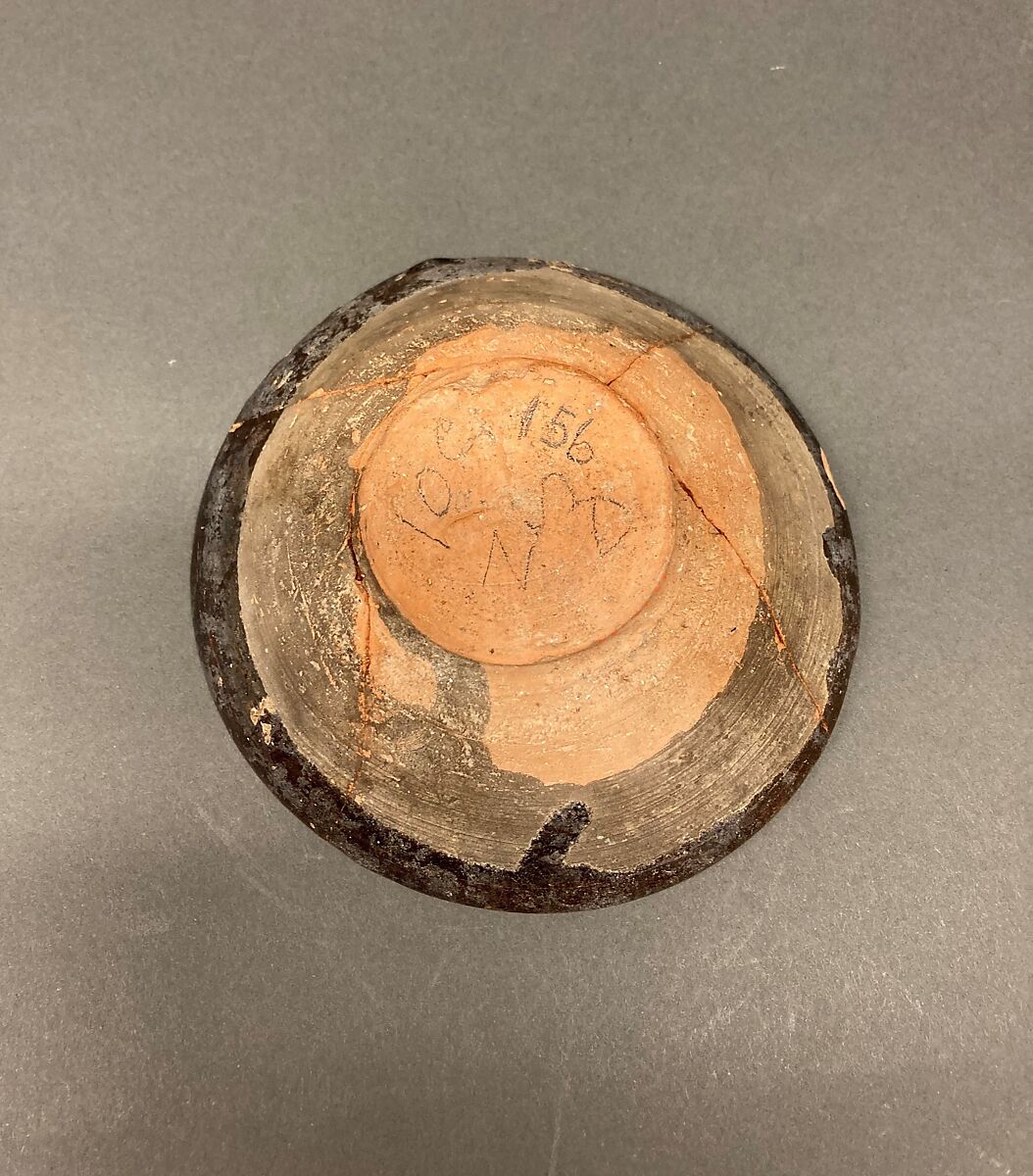 Bowl, Earthenware; brown slip covered with slip decoration under transparent greenish glaze