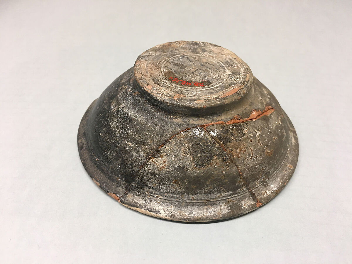 Bowl, Earthenware; purplish- brown slip with slip decoration under transparent glaze