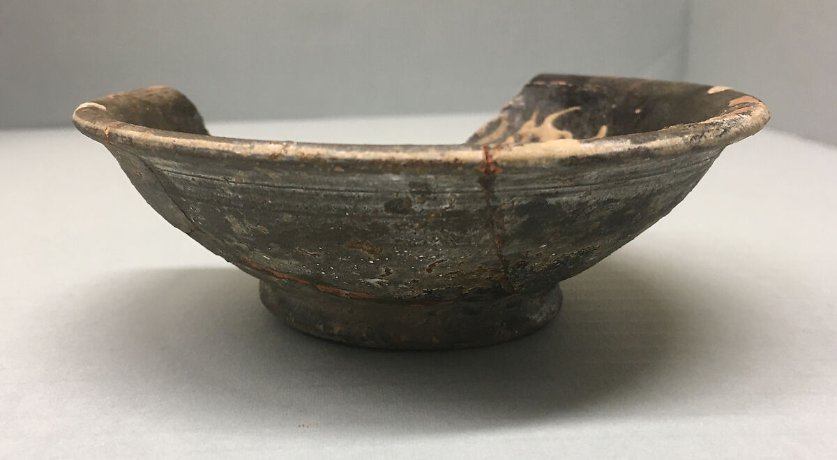 Bowl, Earthenware; purplish- brown slip with slip decoration under transparent glaze