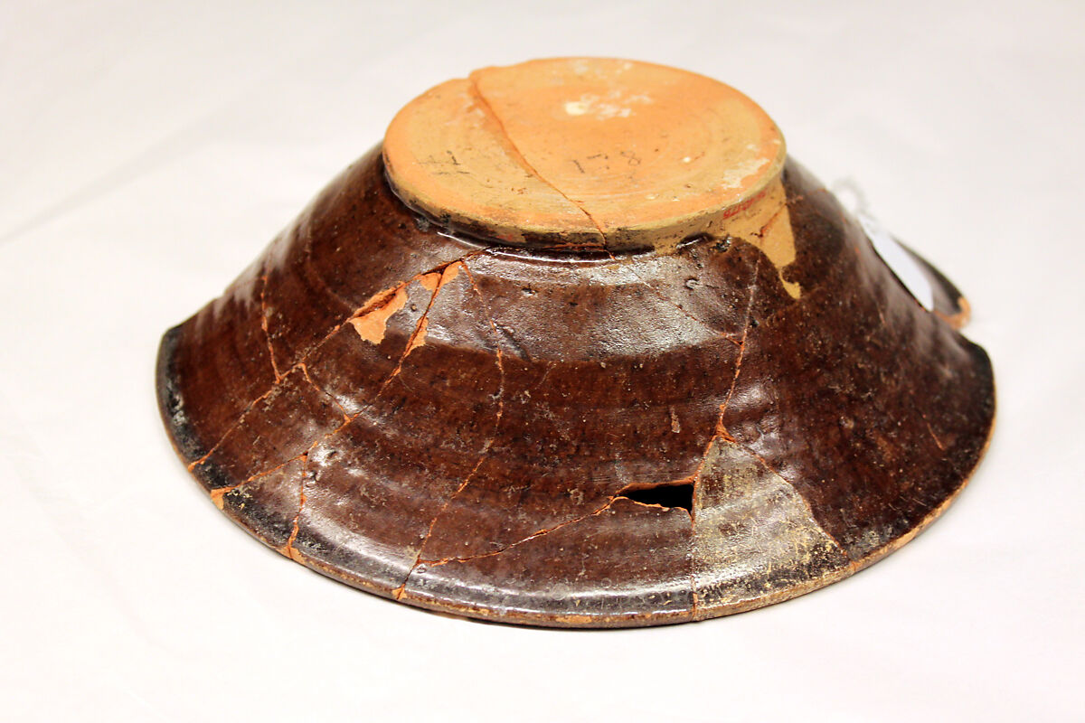 Bowl, Earthenware; brown slip under transparent glaze