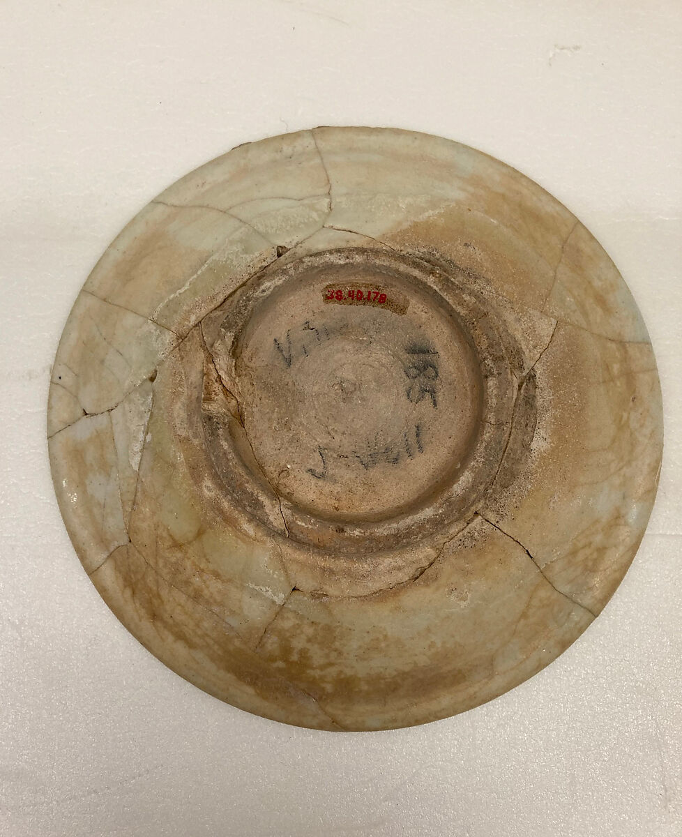 Plate, Earthenware; white slip under transparent greenish glaze