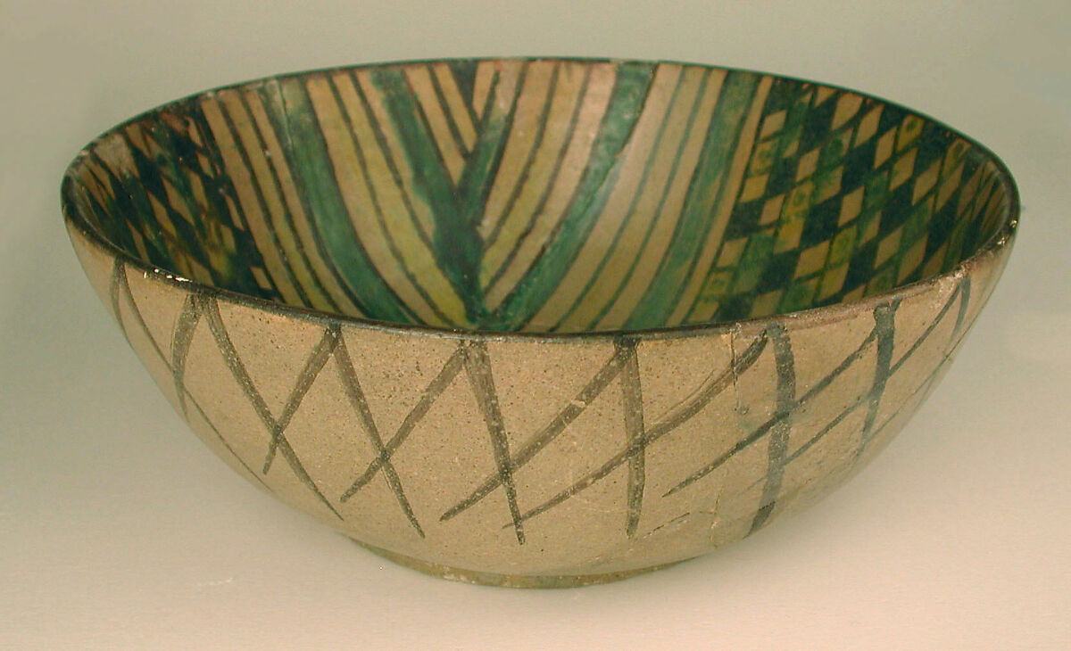Bowl, Earthenware; painted in black slip and polychrome pigments under transparent colorless glaze (buff ware)