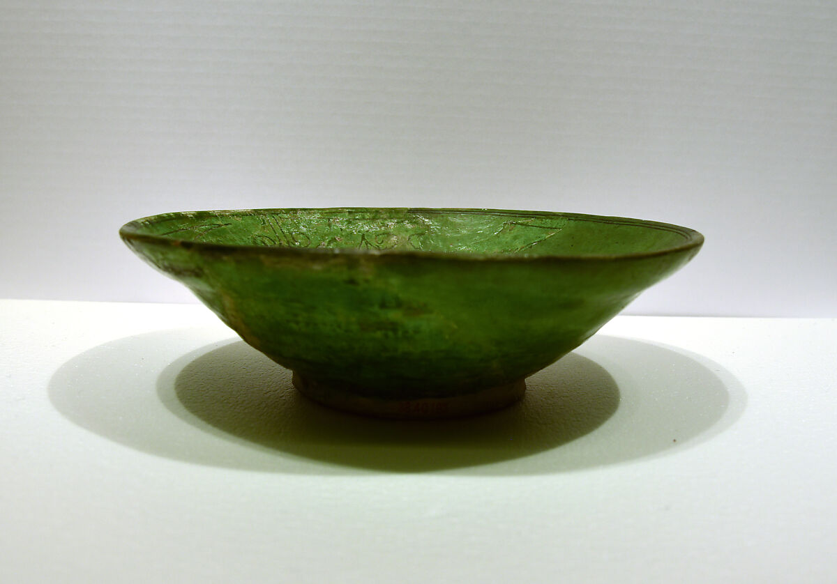 Bowl, Earthenware; white slip under transparent green glaze, incised 