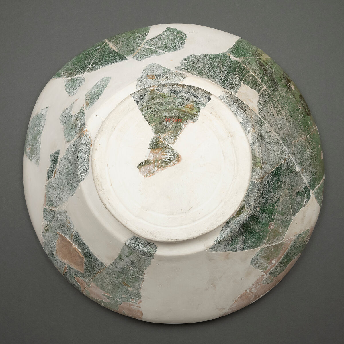 Fragment of a Bowl, Earthenware; white slip under green glaze, incised