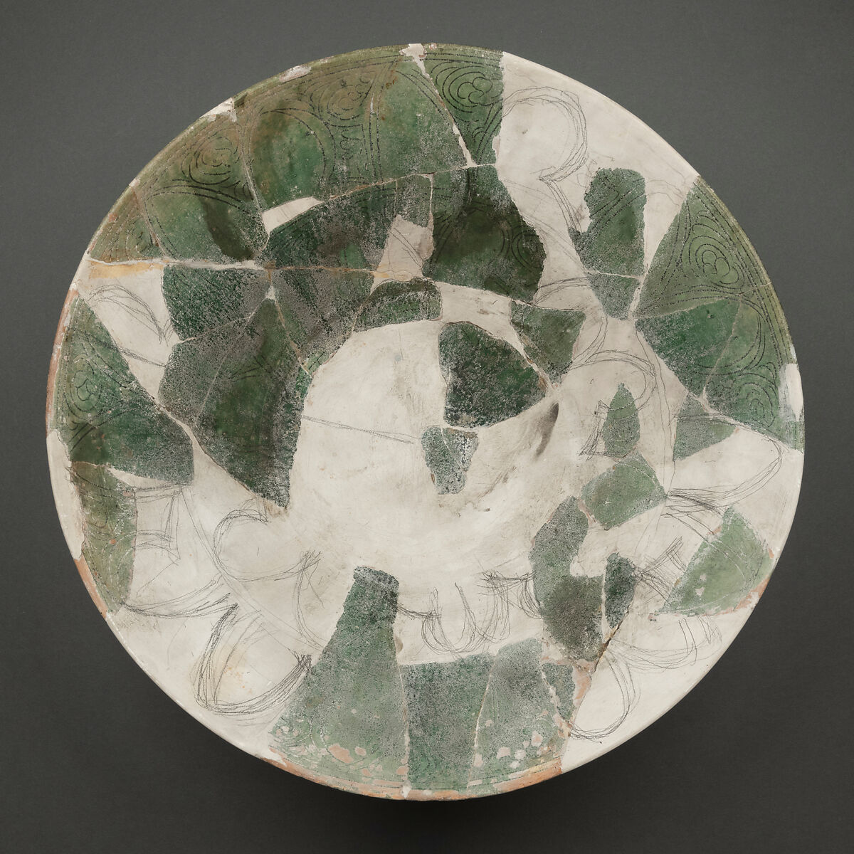 Fragment of a Bowl, Earthenware; white slip under green glaze, incised