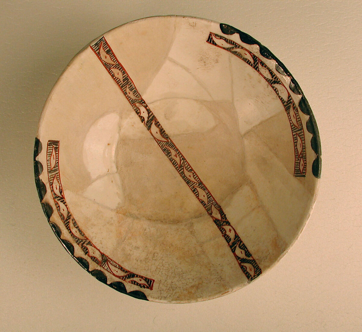 Bowl, Earthenware; white slip with polychrome slip decoration under transparent glaze 