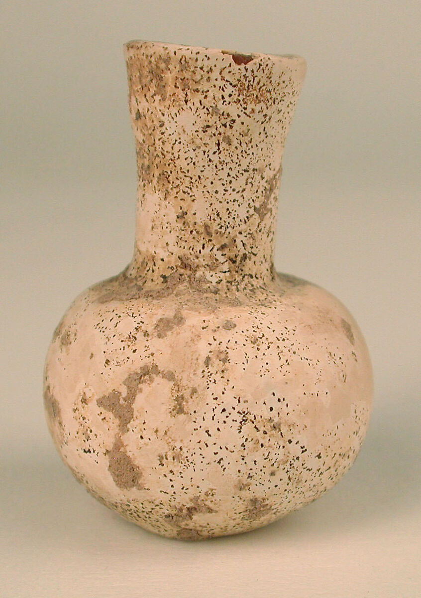 Bottle, Glass, colorless; blown (now opaque)