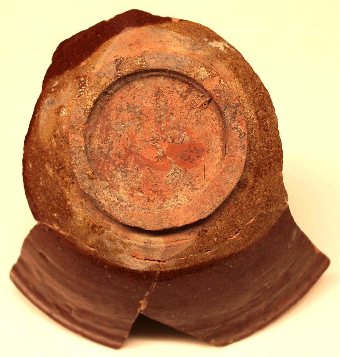 Fragment of a Bowl, Earthenware; red and yellow slip decoration under transparent glaze