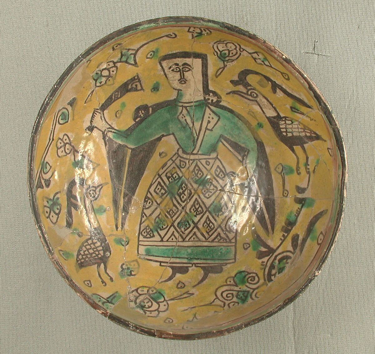 Bowl with a Figure and Birds, Earthenware; polychrome decoration under transparent glaze (buff ware)