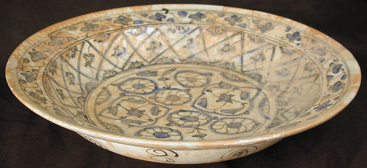 Dish, Earthenware; white slip with polychrome slip decoration under transparent bluish glaze