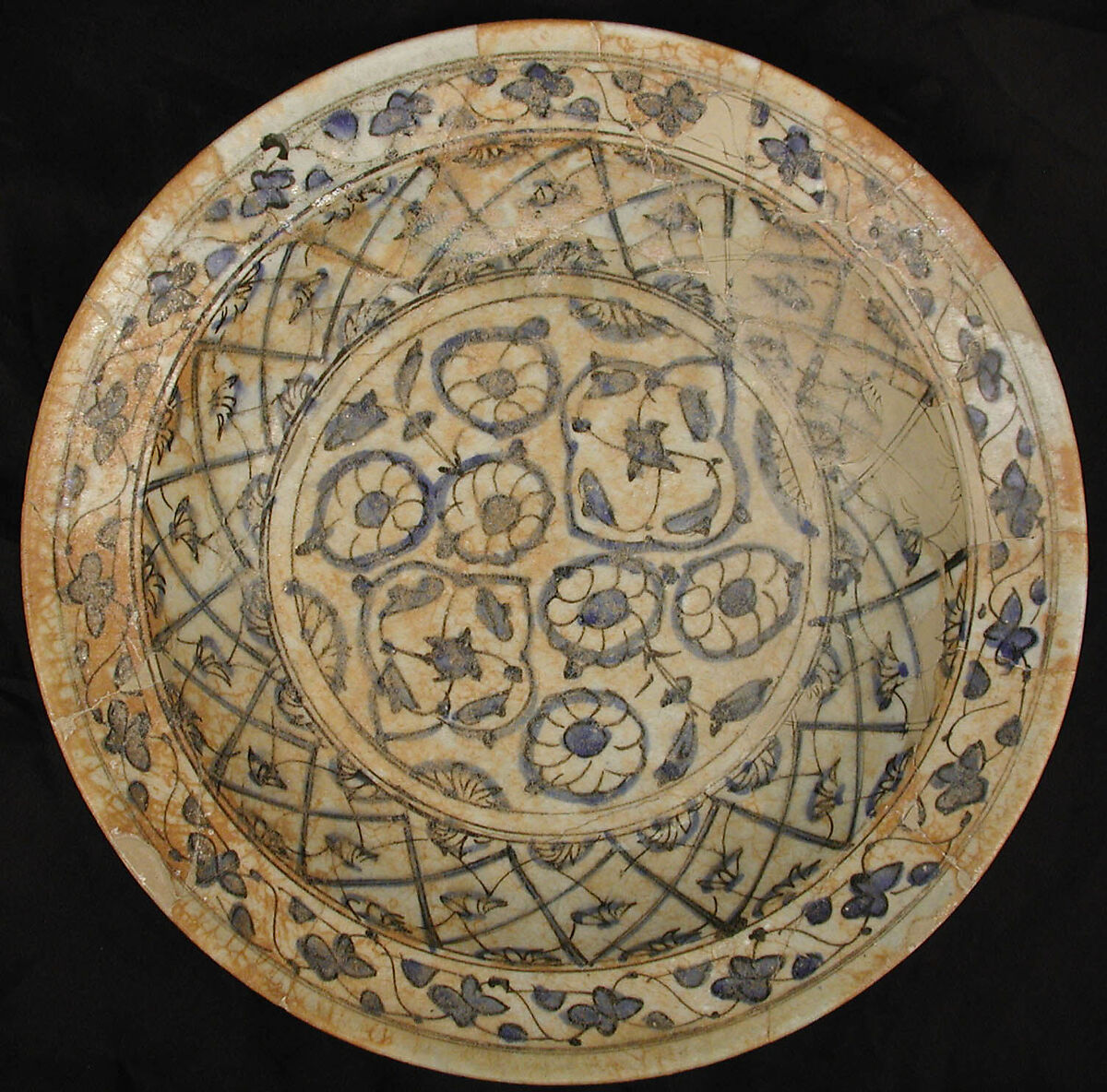 Dish, Earthenware; white slip with polychrome slip decoration under transparent bluish glaze 