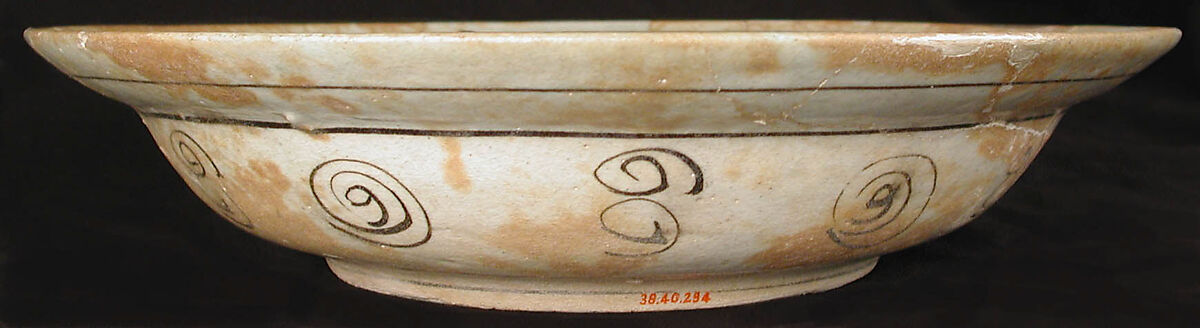 Dish, Earthenware; white slip with polychrome slip decoration under transparent bluish glaze