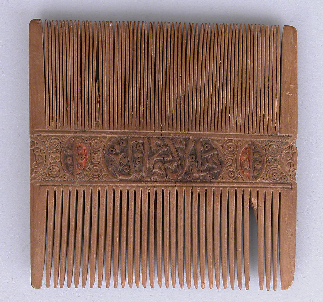 Comb, Wood; carved, sawn, drilled, and painted 