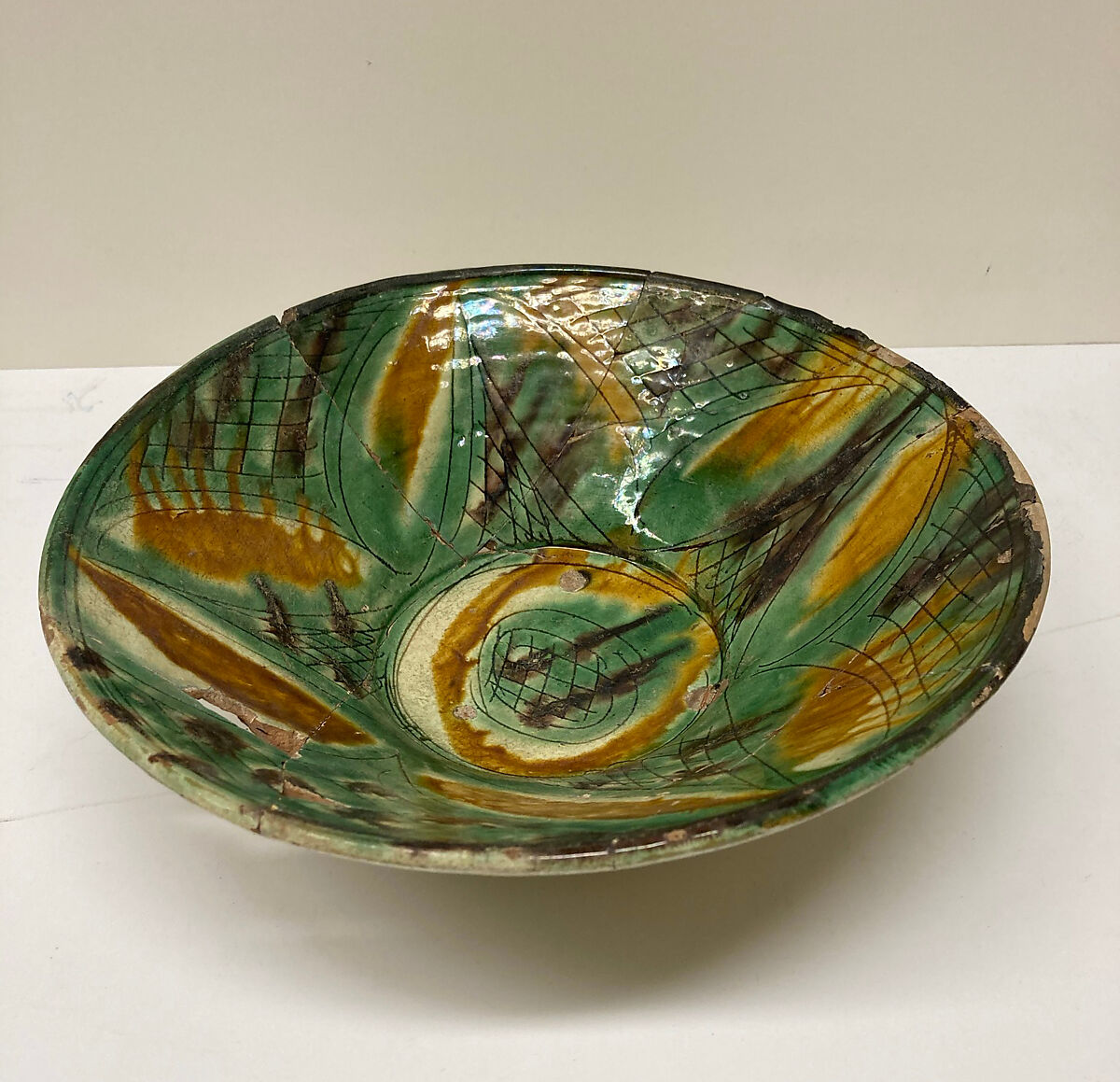 Bowl, Earthenware; white slip, incised and splashed with polychrome glazes under transparent glaze (sgraffito ware)