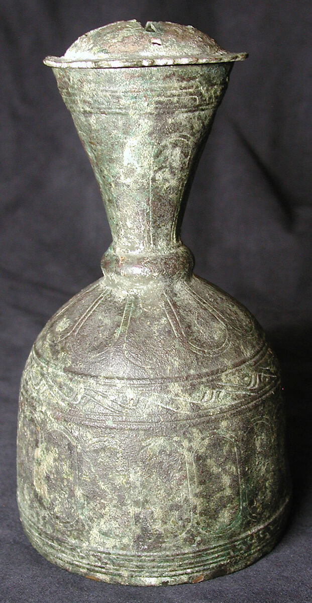 Metal Bottle with Faceted Design, Brass; cast, chased, engraved 