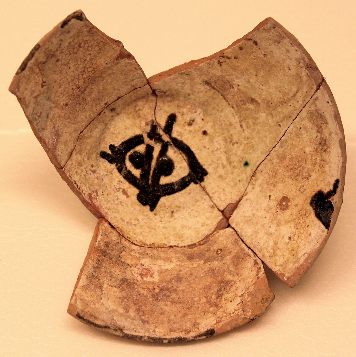 Bowl, Earthenware; white slip decorated with black decoration, glazed