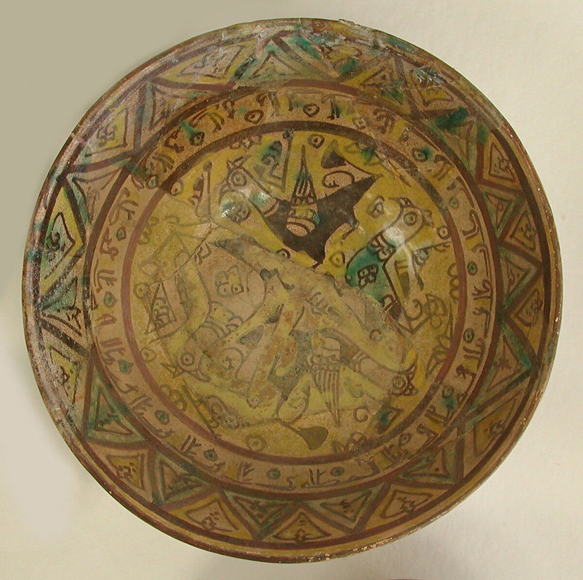 Bowl, Earthenware; painted in black slip and polychrome pigments under transparent colorless glaze (buff ware) 