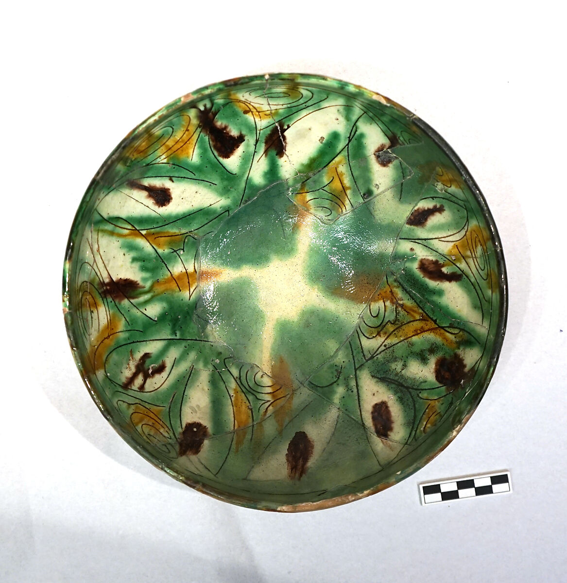 Bowl, Earthenware; white slip, incised and splashed with polychrome glazes under transparent glaze (sgraffito ware)