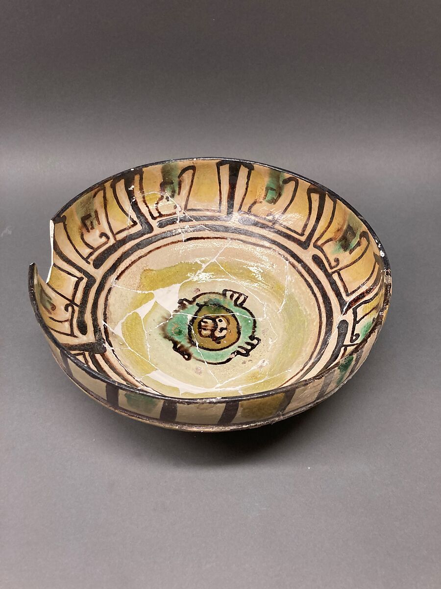 Dish, Earthenware; brown-black slip, green slip decoration under glaze 