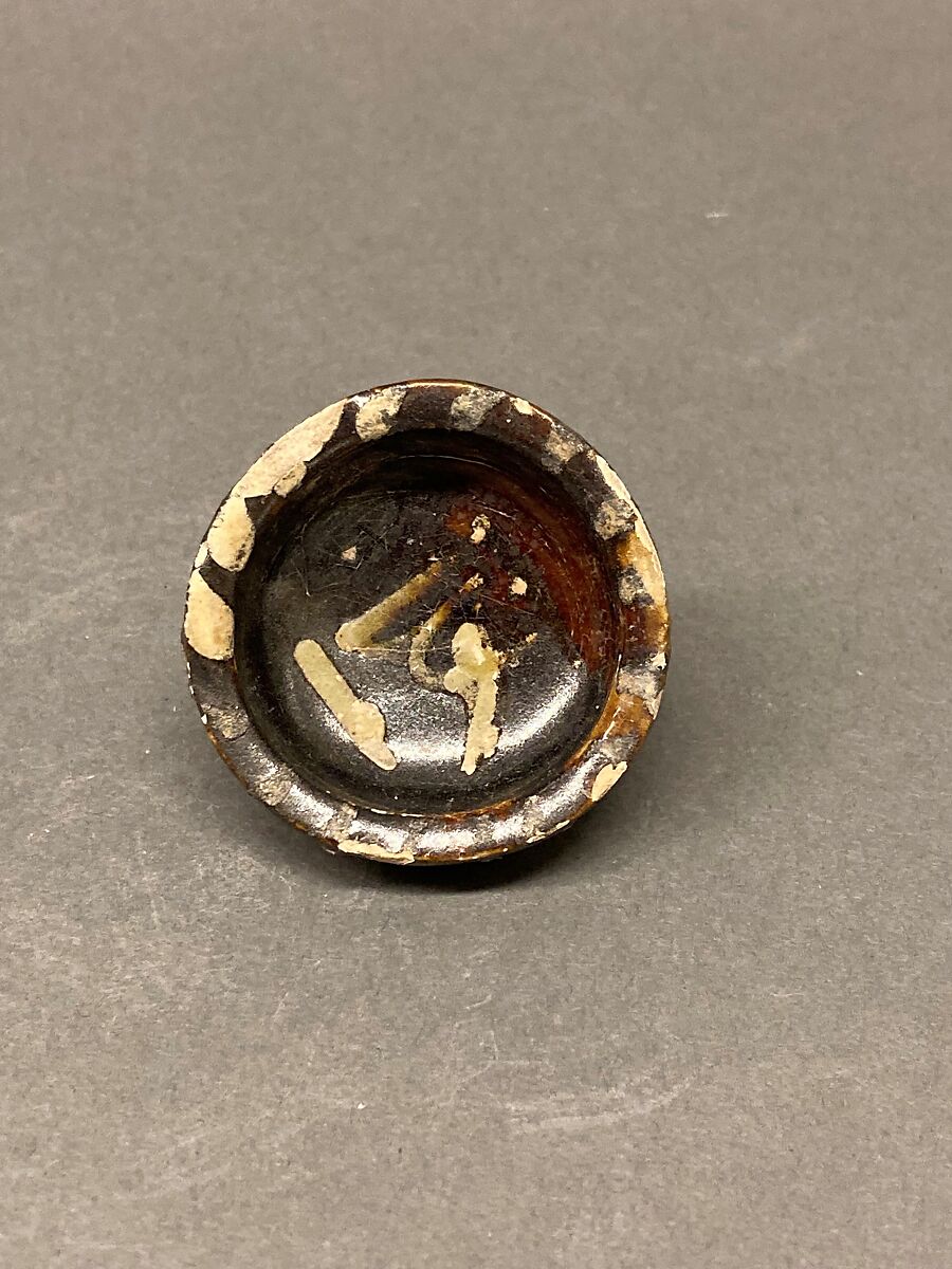 Dish, Earthenware; brown-black slip, green slip decoration under glaze