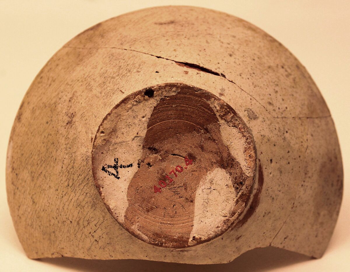 Bowl, Earthenware; white slip, decoration in brown-black and glaze tinged with yellow
