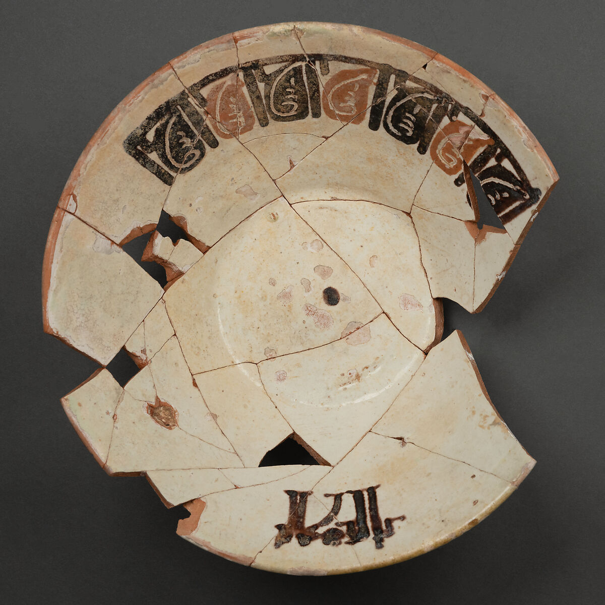 Bowl, Earthenware; white slip, decoration in brown, black and red, glazed 